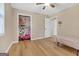 This bedroom boasts wood flooring, closet storage and neutral colors at 33 Russell Rd, Mcdonough, GA 30252