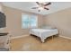 Cozy bedroom with hardwood floors, a double bed, and a ceiling fan at 33 Russell Rd, Mcdonough, GA 30252