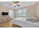 Bright bedroom featuring hardwood floors, a dresser, and a comfortable double bed at 33 Russell Rd, Mcdonough, GA 30252