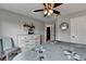 Bedroom features a dresser, ceiling fan, and comfortable decor and ample sunlight at 3845 Lake Lanier Dr, Duluth, GA 30097