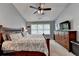 Comfortable bedroom includes a ceiling fan, large dresser and window providing ample natural light at 3845 Lake Lanier Dr, Duluth, GA 30097