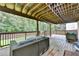 Expansive wooden deck with stylish outdoor seating and lounge area, perfect for entertaining and relaxation at 3845 Lake Lanier Dr, Duluth, GA 30097