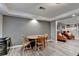 Dining area featuring a wood table with seating for four people at 3845 Lake Lanier Dr, Duluth, GA 30097