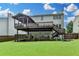 Multi-level deck and screened porch, providing multiple outdoor spaces for relaxation and entertainment at 3845 Lake Lanier Dr, Duluth, GA 30097