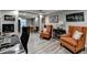 Open living space with wood-look floors, armchairs, and natural light at 3845 Lake Lanier Dr, Duluth, GA 30097