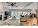 Bright living room with hardwood floors, fireplace, and large windows with a view at 3845 Lake Lanier Dr, Duluth, GA 30097