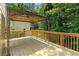 Large wooden back deck offering ample space for outdoor entertaining at 77 Skyland Dr, Roswell, GA 30075