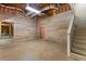 Spacious basement area with wooden paneling, exposed ductwork and open framework at 77 Skyland Dr, Roswell, GA 30075