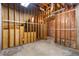 Unfinished basement with exposed framing, concrete floors and utility infrastructure at 77 Skyland Dr, Roswell, GA 30075