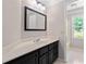 Bathroom with a vanity and mirror, leading to the toilet and shower at 77 Skyland Dr, Roswell, GA 30075