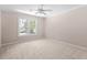 Bedroom featuring neutral colors, carpeted floors, and a window at 77 Skyland Dr, Roswell, GA 30075