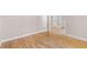 Bedroom featuring hardwood floors and neutral walls with open doorway at 77 Skyland Dr, Roswell, GA 30075