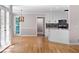 Bright kitchen features hardwood floors, white cabinets, and an open design for modern living at 77 Skyland Dr, Roswell, GA 30075