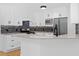 Well-equipped kitchen with stainless steel appliances, mosaic backsplash, and granite countertops at 77 Skyland Dr, Roswell, GA 30075