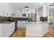 Stylish kitchen features stainless appliances, granite counters, and white cabinetry at 77 Skyland Dr, Roswell, GA 30075