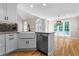 Open kitchen design with stainless appliances and granite counters connecting to a sunny breakfast nook at 77 Skyland Dr, Roswell, GA 30075