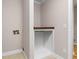 Well-lit laundry room featuring a built-in shelf and essential hookups, ready for appliances at 77 Skyland Dr, Roswell, GA 30075