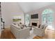 Bright and airy living room with hardwood floors, a fireplace, high ceilings, and French doors to the outdoors at 77 Skyland Dr, Roswell, GA 30075
