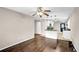 Open concept dining room flowing into the kitchen with dark stained hardwood floors at 91 Tatum St, Marietta, GA 30060
