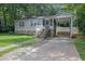 Charming single-story home with a stone foundation, front porch, and covered carport at 91 Tatum St, Marietta, GA 30060