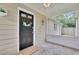 Cozy front porch with a decorative wreath on the black front door at 91 Tatum St, Marietta, GA 30060