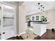 Open-concept kitchen featuring an island, stainless steel appliances, and white cabinetry at 91 Tatum St, Marietta, GA 30060