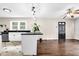 Open-concept kitchen features an island, stainless steel appliances, and white cabinetry at 91 Tatum St, Marietta, GA 30060