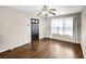 Bright living room with hardwood floors, a ceiling fan, and natural light from the windows at 91 Tatum St, Marietta, GA 30060