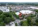 Aerial shot features the property in a retail area with lots of tree coverage in Atlanta, GA at 1190 Hardee Ne St, Atlanta, GA 30307