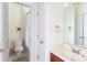Bright bathroom features a toilet, tub with shower, vanity and a neutral color palette at 1190 Hardee Ne St, Atlanta, GA 30307