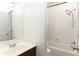 Neutral bathroom features a shower/tub with white subway tile surround and a stylish shower head at 1190 Hardee Ne St, Atlanta, GA 30307