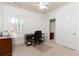 Bedroom features carpet, light-filled windows, ceiling fan, and access to a private bathroom at 1190 Hardee Ne St, Atlanta, GA 30307
