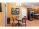 Bright dining area adjacent to the kitchen, featuring hardwood floors and modern lighting at 1190 Hardee Ne St, Atlanta, GA 30307