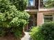 Inviting front entrance featuring brick accents, a cozy porch, and mature landscaping at 1190 Hardee Ne St, Atlanta, GA 30307