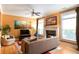 Bright living room features a fireplace, hardwood floors, and ample natural light at 1190 Hardee Ne St, Atlanta, GA 30307