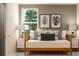 Cozy bedroom featuring modern art prints, a comfortable daybed, and stylish bedside lamps at 1817 Holmsey Se Cir, Conyers, GA 30094