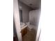 Bathroom features a toilet, sink, vanity, and bathtub with a shower curtain at 3040 Garnet Way, Atlanta, GA 30349