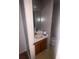 Bathroom features a sink and vanity with mirror and toilet nearby at 3040 Garnet Way, Atlanta, GA 30349
