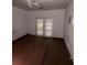 Bedroom featuring a ceiling fan and double doors to the outside at 3040 Garnet Way, Atlanta, GA 30349