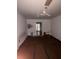 Bedroom view with ceiling fan, showing electrical panel and hallway beyond at 3040 Garnet Way, Atlanta, GA 30349