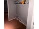 Corner storage with shelves featuring household items and exposed pipes at 3040 Garnet Way, Atlanta, GA 30349