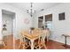 Cozy dining area with hardwood floors, natural light, and chandelier at 100 Inspiration Ln, Dallas, GA 30157