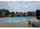 Community pool featuring ample seating, a mushroom water feature, and a covered cabana at 100 Inspiration Ln, Dallas, GA 30157
