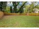 Expansive backyard with lush green grass and privacy fence, creating a serene outdoor space at 1302 Ladd St, Atlanta, GA 30310