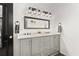 Dual sink bathroom vanity featuring sleek gray cabinets, marble countertops, and modern lighting at 1302 Ladd St, Atlanta, GA 30310