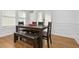 Bright dining room with hardwood floors and wainscoting at 1302 Ladd St, Atlanta, GA 30310