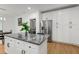Kitchen island with gray granite countertops and white cabinets at 1302 Ladd St, Atlanta, GA 30310