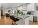 Modern kitchen island with granite countertops and bar seating at 1302 Ladd St, Atlanta, GA 30310