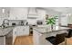 A well-lit kitchen featuring an island with granite countertops and modern appliances at 1302 Ladd St, Atlanta, GA 30310