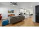 Open-concept living room with hardwood floors and a view of the modern kitchen at 1302 Ladd St, Atlanta, GA 30310